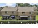 Home's backyard with a small patio, an outdoor dining space and a fenced in yard at 184 Sandlewood Trl # 2, Winter Park, FL 32789