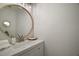Clean bathroom featuring a modern vanity, updated faucet, and elegant lighting at 184 Sandlewood Trl # 2, Winter Park, FL 32789