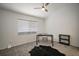 Neutral room featuring a desk, dark shelving, a neutral chair, and a cowhide rug at 184 Sandlewood Trl # 2, Winter Park, FL 32789