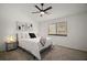 Bright bedroom with a ceiling fan, and stylish decor for a relaxing and comfortable space at 184 Sandlewood Trl # 2, Winter Park, FL 32789