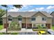 Charming townhome featuring well-maintained landscaping, inviting curb appeal, and convenient parking at 184 Sandlewood Trl # 2, Winter Park, FL 32789