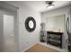 Cozy kitchen nook with modern shelving and adjacent half bath at 184 Sandlewood Trl # 2, Winter Park, FL 32789