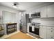 Bright kitchen with stainless steel appliances, white cabinets, and ample counter space at 184 Sandlewood Trl # 2, Winter Park, FL 32789