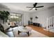 Cozy living area with sliding glass door, hardwood floors and comfortable seating at 184 Sandlewood Trl # 2, Winter Park, FL 32789