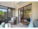 Relaxing patio with comfortable seating and ceiling fan, perfect for outdoor enjoyment at 184 Sandlewood Trl # 2, Winter Park, FL 32789