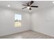 Minimalist bedroom design with a ceiling fan, ample light, and neutral walls at 1900 Sw 178Th Street Rd, Ocala, FL 34473