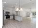 Modern kitchen featuring stainless steel appliances and granite countertops in an open layout at 1900 Sw 178Th Street Rd, Ocala, FL 34473