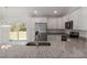 Stylish kitchen with stainless steel appliances, granite countertops, and a functional island at 1900 Sw 178Th Street Rd, Ocala, FL 34473
