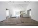 Open-concept living area featuring wood floors, recessed lighting, and abundant natural light from sliding glass doors at 1900 Sw 178Th Street Rd, Ocala, FL 34473