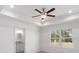 Bright main bedroom with recessed lighting, wood floors, ensuite bathroom, and a window overlooking the outdoors at 1900 Sw 178Th Street Rd, Ocala, FL 34473
