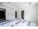 Unfinished main bedroom featuring wood flooring, recessed lighting, a tray ceiling, and an ensuite bathroom at 1900 Sw 178Th Street Rd, Ocala, FL 34473