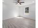 Spacious bedroom featuring a ceiling fan and large window for natural light at 2041 Sw 178Th Lane Rd, Ocala, FL 34473