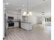 Bright kitchen features stainless steel appliances, modern cabinetry, and a granite-topped island at 2041 Sw 178Th Lane Rd, Ocala, FL 34473