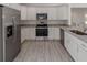 Bright kitchen with stainless steel appliances, granite countertops, and white cabinetry at 2041 Sw 178Th Lane Rd, Ocala, FL 34473