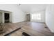 An open-concept living room boasts new floors and lots of natural light at 2041 Sw 178Th Lane Rd, Ocala, FL 34473