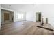 An open-concept living room boasts new floors and lots of natural light at 2041 Sw 178Th Lane Rd, Ocala, FL 34473