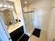 Bathroom featuring vanity with sink and glass shower with a tiled accent wall for a modern, clean aesthetic at 225 Celebration Pl # 527, Kissimmee, FL 34747