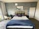 Comfortable bedroom featuring a king bed with decorative pillows, desk, and modern decor at 225 Celebration Pl # 527, Kissimmee, FL 34747