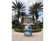 Beautiful shot of the Melia Orlando with palm trees and a creatively painted bench at 225 Celebration Pl # 527, Kissimmee, FL 34747