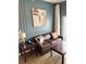 Comfortable living room featuring a leather sofa, modern artwork, and stylish decor at 225 Celebration Pl # 527, Kissimmee, FL 34747