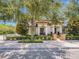 Charming two-story home with lush landscaping, brick accents and mature shade trees at 242 W Lyman Ave, Winter Park, FL 32789