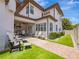 Gorgeous home featuring a well-manicured backyard with an outdoor kitchen and cozy seating area at 242 W Lyman Ave, Winter Park, FL 32789