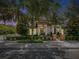 Inviting home exterior with manicured landscaping and wrought iron fence at 242 W Lyman Ave, Winter Park, FL 32789
