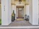 Elegant front porch with custom door, stylish planters, lanterns and brick pavers at 242 W Lyman Ave, Winter Park, FL 32789