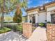 Charming home featuring a covered front porch, beautiful landscaping and a brick walkway at 242 W Lyman Ave, Winter Park, FL 32789