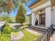 Charming home with a covered front porch, brick steps and meticulously maintained landscaping at 242 W Lyman Ave, Winter Park, FL 32789