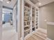 Hallway with built-in bookshelves and views of the bedroom at 242 W Lyman Ave, Winter Park, FL 32789