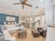 Open-concept living room with a ceiling fan, a comfortable couch and a view into the dining room and kitchen at 242 W Lyman Ave, Winter Park, FL 32789