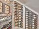 Custom wine cellar features ample wine storage with custom racks and stylish lighting at 242 W Lyman Ave, Winter Park, FL 32789