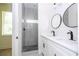 Bathroom with shower, granite counters, double sinks and black fixtures at 25 W 7Th St, Apopka, FL 32703
