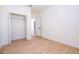 Bright bedroom features a closet, wood-look floors and neutral paint at 25 W 7Th St, Apopka, FL 32703
