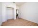 Bright bedroom features a closet, wood-look floors and neutral paint at 25 W 7Th St, Apopka, FL 32703