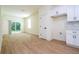Bright and airy living space with access to outdoor area, featuring light wood flooring and white walls at 25 W 7Th St, Apopka, FL 32703