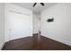 Bright bedroom features hardwood floors and large closet with sleek sliding doors at 25859 Crossings Bluff Ln, Sorrento, FL 32776