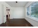 Bedroom featuring hard wood floors and bright window with a beautiful outside view at 25859 Crossings Bluff Ln, Sorrento, FL 32776