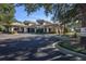 Charming community clubhouse with covered entryway and beautifully landscaped surroundings at 25859 Crossings Bluff Ln, Sorrento, FL 32776
