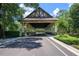 Community entrance with covered entryway and well-maintained landscaping at 25859 Crossings Bluff Ln, Sorrento, FL 32776