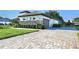 Charming one-story home with manicured landscaping, stone accents, and a paved driveway at 25859 Crossings Bluff Ln, Sorrento, FL 32776