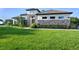 Lush front yard and stone accents create a welcoming exterior for this single-Gathering home at 25859 Crossings Bluff Ln, Sorrento, FL 32776