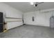 Spacious garage with ample storage cabinets and room for multiple vehicles at 25859 Crossings Bluff Ln, Sorrento, FL 32776