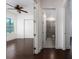 Hallway view showcases bedroom and bathroom with sleek tile shower at 25859 Crossings Bluff Ln, Sorrento, FL 32776