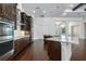 Gourmet kitchen with stainless steel appliances and a center island, perfect for cooking and gathering at 25859 Crossings Bluff Ln, Sorrento, FL 32776