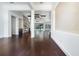 Spacious open-concept living room showcasing hardwood floors and plenty of natural light at 25859 Crossings Bluff Ln, Sorrento, FL 32776