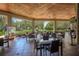Inviting outdoor seating area with tables, chairs, and views of the surrounding landscape at 25859 Crossings Bluff Ln, Sorrento, FL 32776