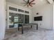 Covered patio featuring pool table, fan and outdoor TV at 25859 Crossings Bluff Ln, Sorrento, FL 32776