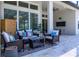 Covered patio with wicker furniture and an outdoor television at 25859 Crossings Bluff Ln, Sorrento, FL 32776